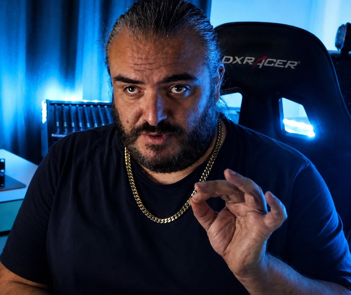 Adam J. Colosimo in his home studio, mid-conversation